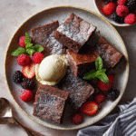 mochi brownies served with ice cream and berries