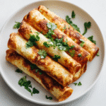Easy Gluten Free Dairy Free Taquitos on white plate close-up