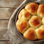 Gluten free dinner rolls fresh out of the oven in a baking dish