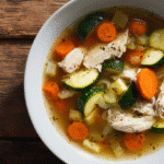 Gluten Free Crockpot Soup in a white bowl with vegetables