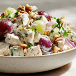 Close-up of creamy Greek yogurt chicken salad with no mayo in white bowl