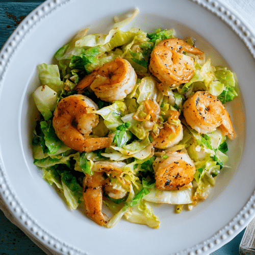 Garlic Shrimp with Sautéed Cabbage plated beautifully