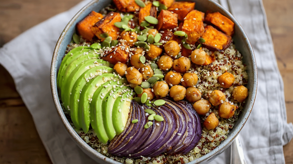 High protein meal under 30 minutes featuring quinoa bowl with roasted sweet potatoes, chickpeas, avocado, edamame, and red onion