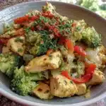 Clean eating chicken veggie stir fry with colorful vegetables in a bowl