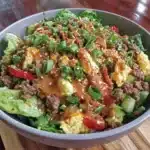Healthy egg roll in a bowl salad with fresh vegetables and toppings