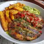Grilled herb chicken bowl with sweet potato fries and avocado salsa