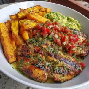 Grilled herb chicken bowl with sweet potato fries and avocado salsa