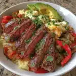 Low carb steak fajita bowl with colorful vegetables and seasoned steak