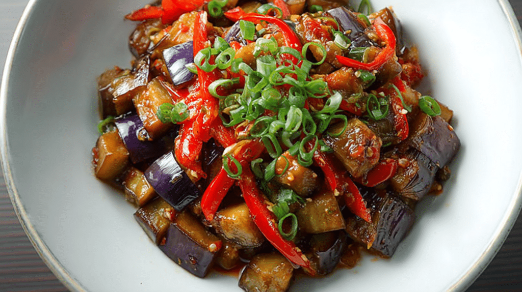 Low carb dinner recipes with savory eggplant stir fry, bell peppers, and green onions in a flavorful sauce