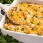 Creamy gluten free chicken rice casserole with cheese and veggies.