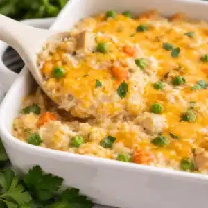 Creamy gluten free chicken rice casserole with cheese and veggies.