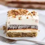 Simple gluten free pudding dessert in a bowl topped with chocolate shavings.