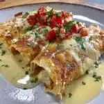 Gluten-free enchiladas topped with fresh ingredients and served warm