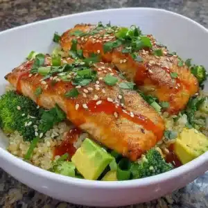 Delicious honey glazed salmon bowl with vibrant vegetables and spices