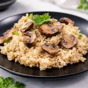 Creamy gluten-free risotto with mushrooms and fresh herbs, perfect for a cozy meal.