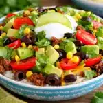 Delicious simple gluten free taco bowls dinner with fresh ingredients and vibrant colors.