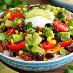 Delicious simple gluten free taco bowls dinner with fresh ingredients and vibrant colors.