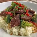 Delicious Gluten-Free Mongolian Beef served with rice and vegetables