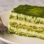 Gluten free matcha tiramisu with egg-free mascarpone filling and gluten-free sponge layers.
