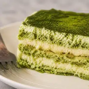 Gluten free matcha tiramisu with egg-free mascarpone filling and gluten-free sponge layers.
