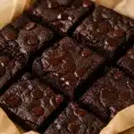 Fudgy gluten free cottage cheese brownies topped with chocolate chips.