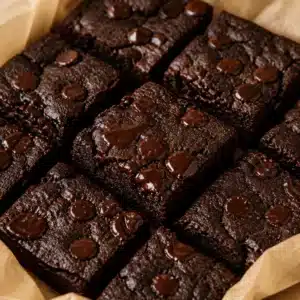 Fudgy gluten free cottage cheese brownies topped with chocolate chips.