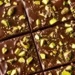 Delicious gluten free Dubai chocolate brownies with pistachio butter topping.