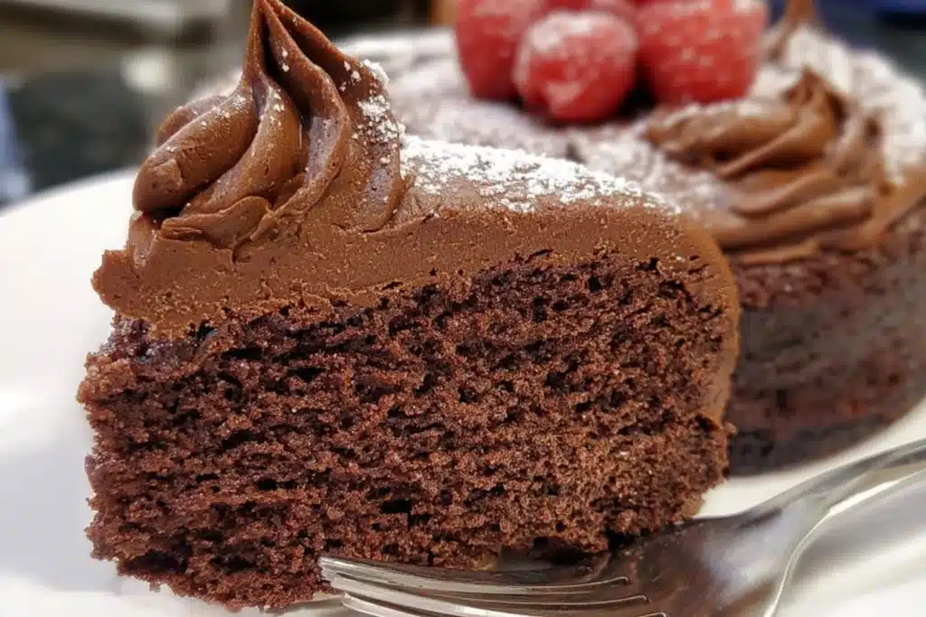 Delicious gluten-free chocolate cake topped with chocolate ganache and berries