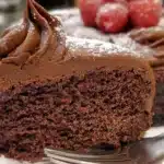Delicious gluten-free chocolate cake topped with chocolate ganache and berries
