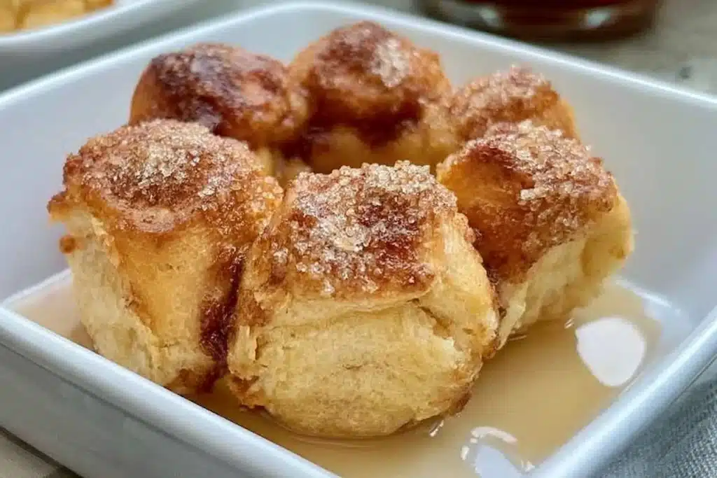 Delicious gluten free monkey bread served warm with buttery glaze.