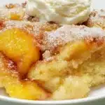 Delicious gluten-free peach cobbler served in a rustic dish