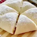 Homemade crescent roll dough ready for baking and serving delicious pastries.