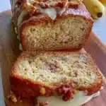 Moist and tender gluten-free banana bread served on a wooden board