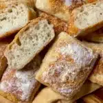 Freshly baked easy gluten free ciabatta rolls on a wooden board