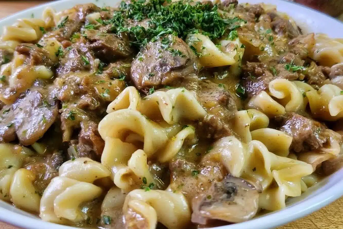 Delicious gluten-free beef stroganoff served on a plate with garnishes