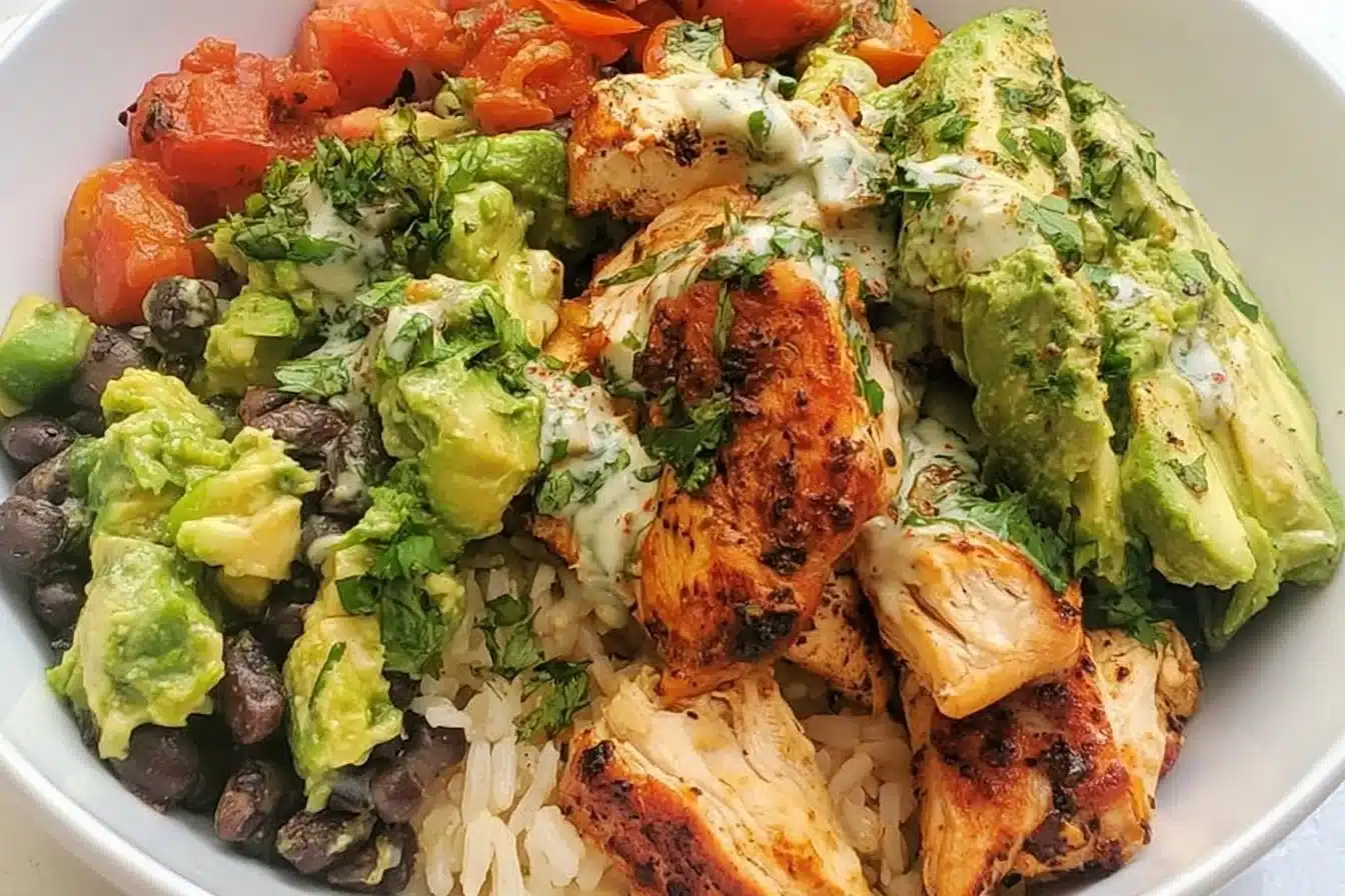 Quick and easy black bean, avocado, and chicken bowls recipe.