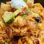 Crockpot Chicken Enchiladas Casserole served in a dish garnished with cilantro