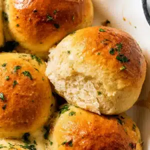 Delicious gluten free cheesy garlic pull-apart rolls baked to golden perfection.
