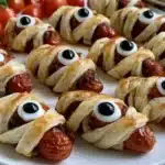 A platter of fun Halloween party food for kids including spooky snacks and treats.