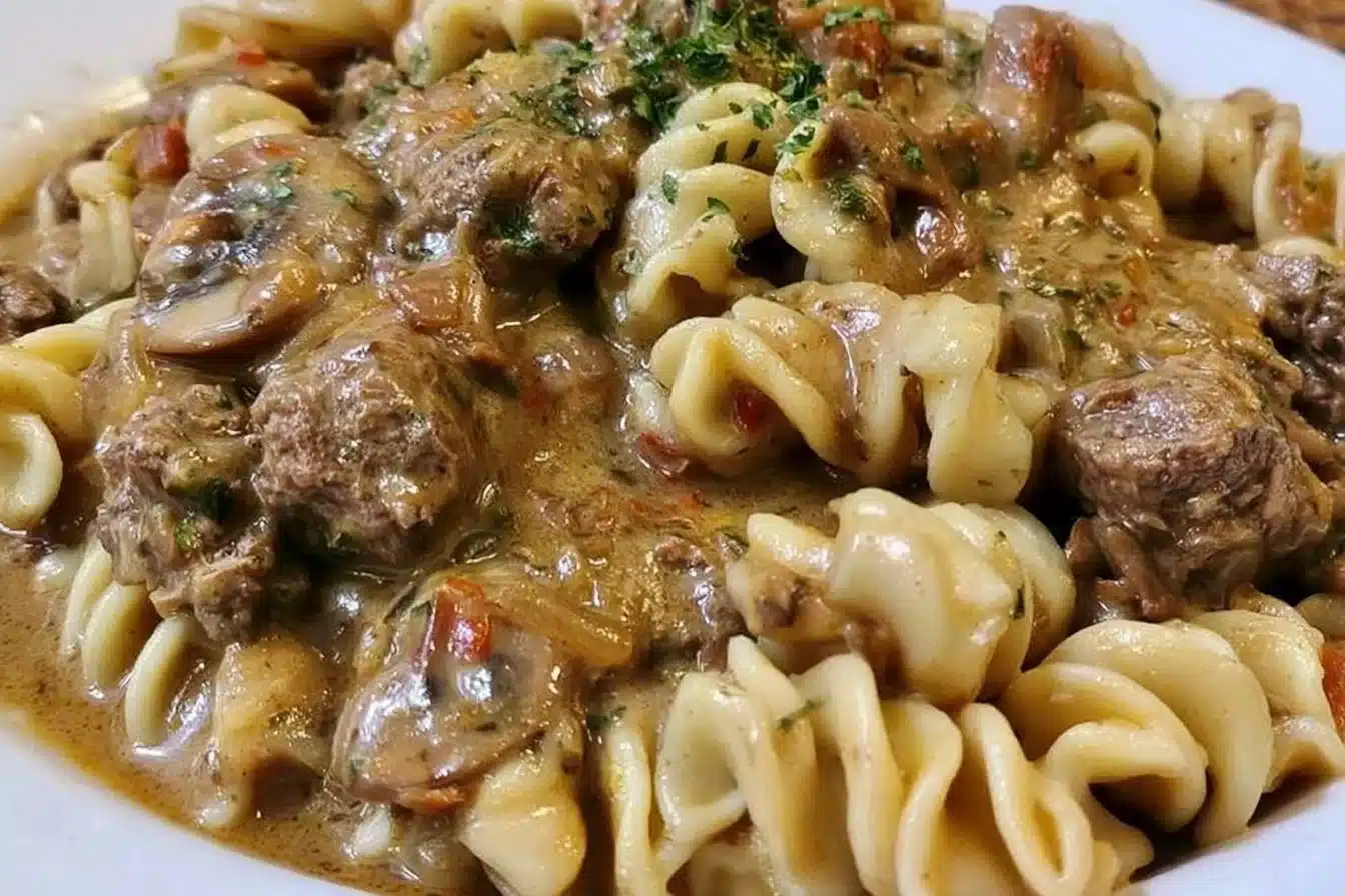 Gluten-free beef stroganoff served in a bowl, showcasing creamy sauce and tender beef.