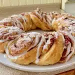 Delicious gluten-free cinnamon roll wreath served as a festive dessert.