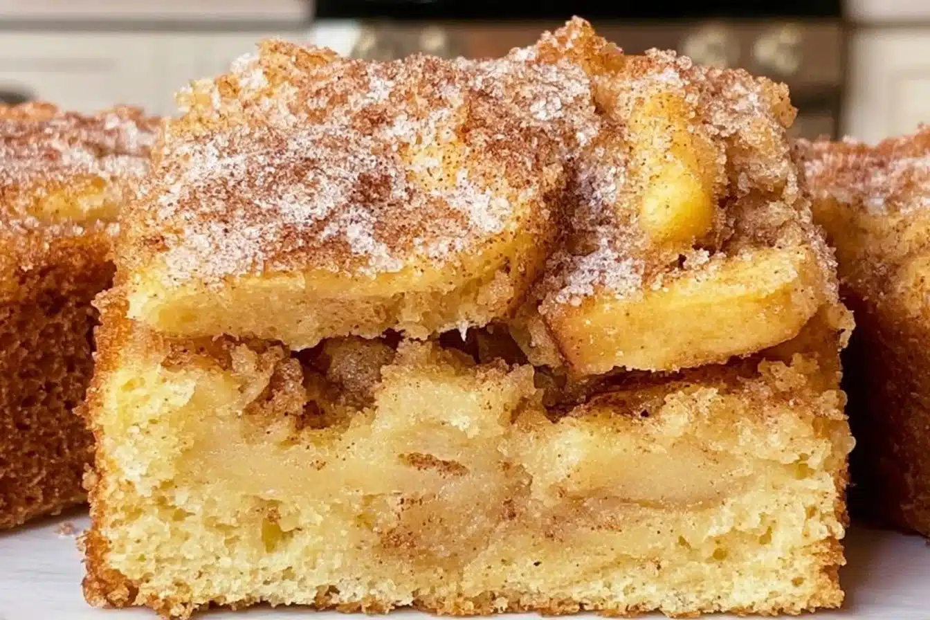 Gluten-free cinnamon sugar apple cake on a plate garnished with cinnamon